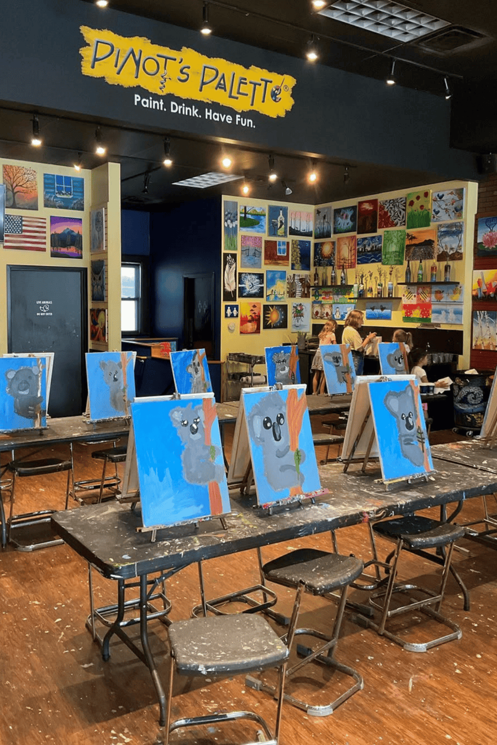 Colorful painting studio at Pinot's Palette for wine and paint events.