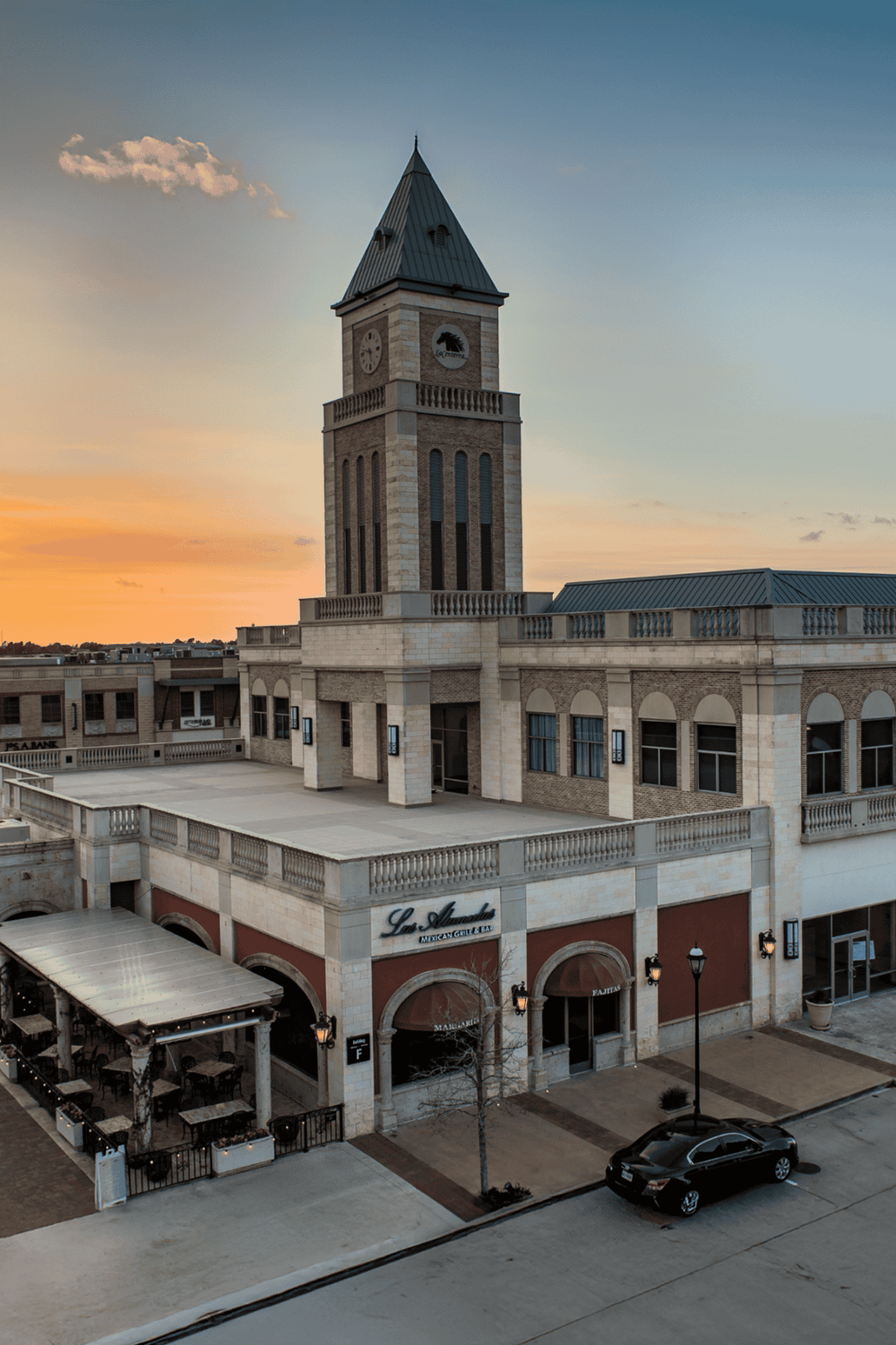 Elegant historic clock tower building in downtown at sunset, showcasing architecture and cityscape.