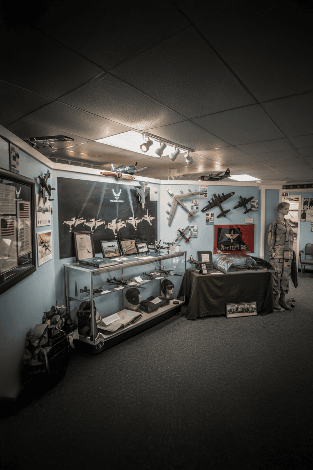 1. Military aircraft and memorabilia display at Quest for Directions museum.