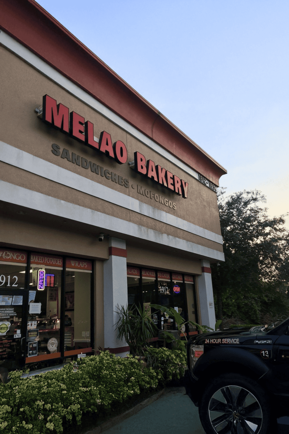 1. Bakery storefront for Melao Bakery, known for sandwiches, mojos, and baked goods.