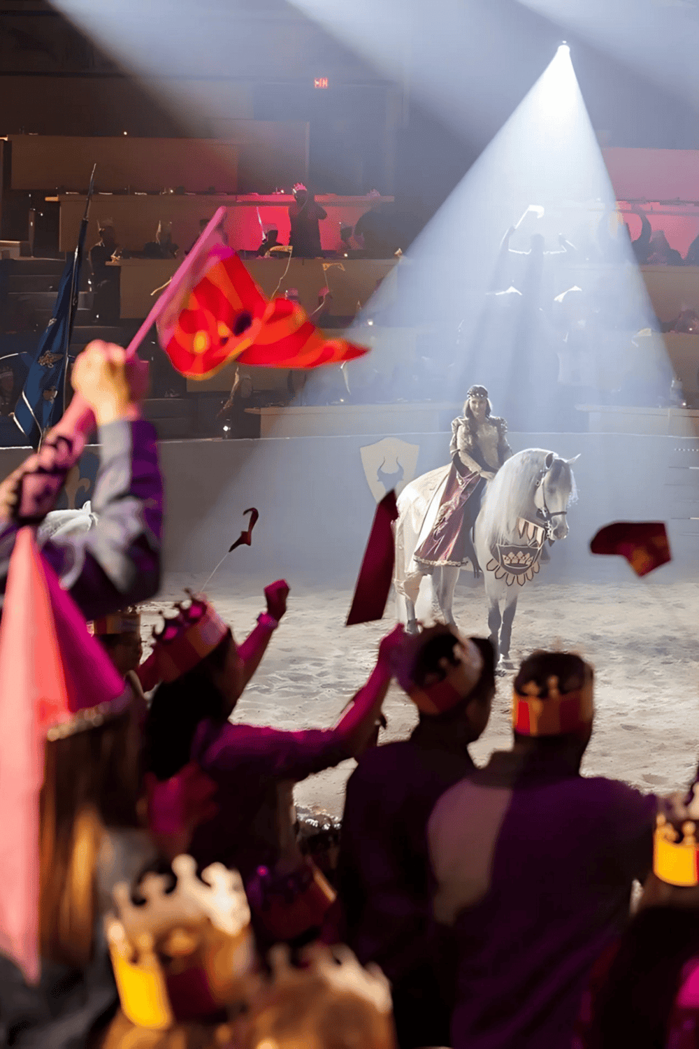 Asian cultural performance at Quest for Directions event, featuring horse riding and vibrant flag waving.