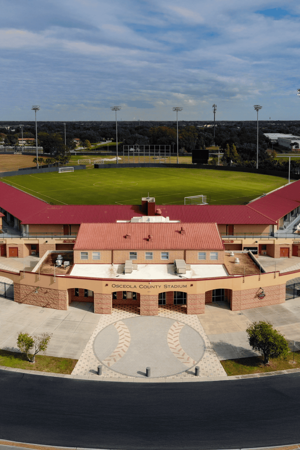 Soccer stadium at Osceola County with lush field and surrounding amenities, part of QuestForDirections sports complex.