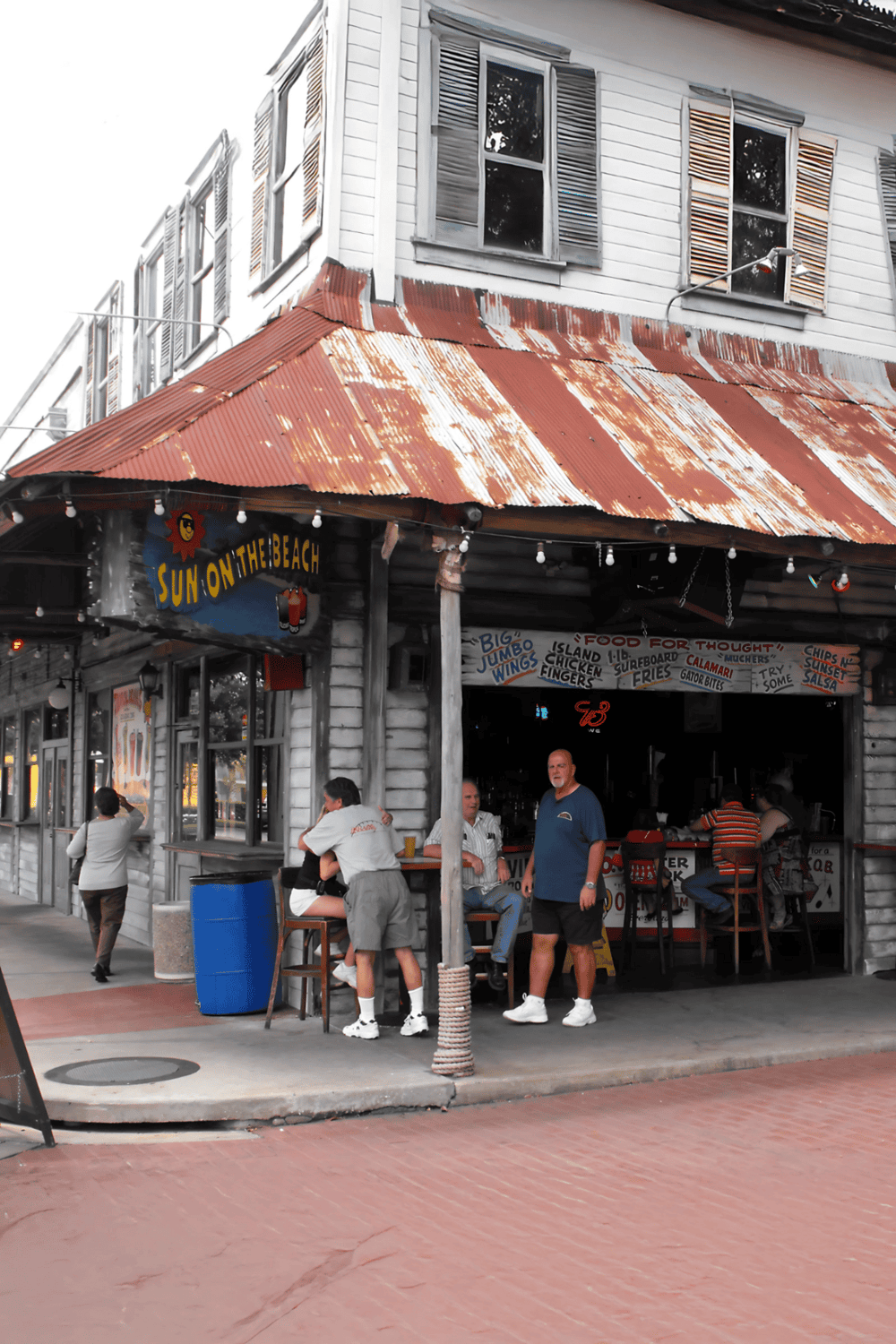 Sun on the Beach restaurant with rustic wooden exterior and metal roof, popular for seafood and beachside dining.