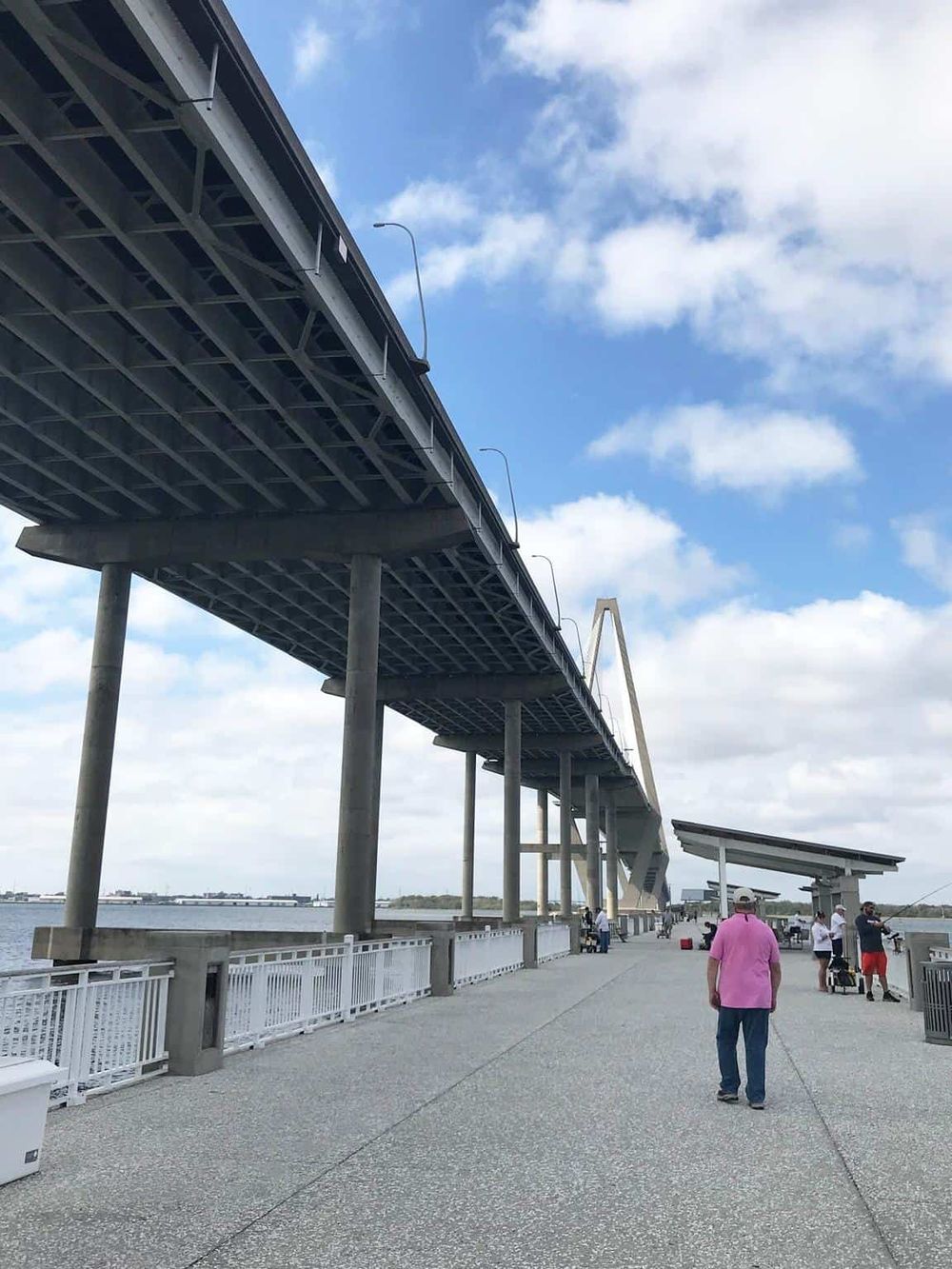 Elevated bridge over water at Quest For Directions, scenic waterfront location for fishing and outdoor activities.