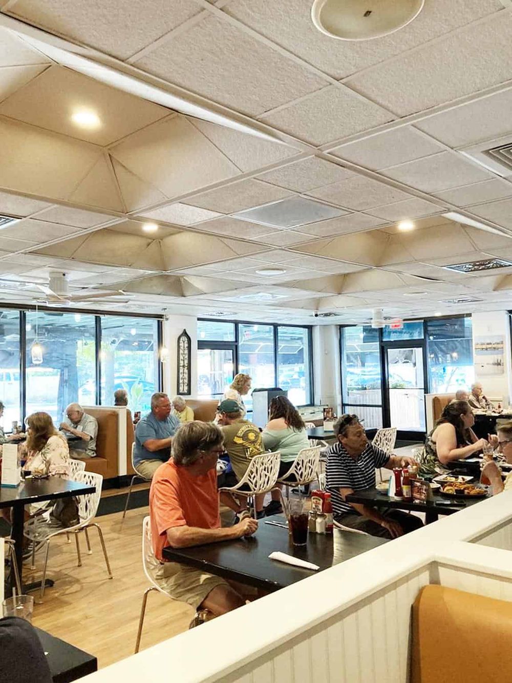 Cozy family-friendly restaurant interior with diners enjoying meals in a casual dining setting.