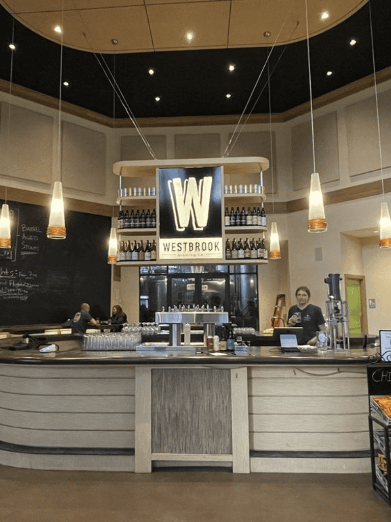 Modern brewery bar at Westbrook with stylish decor and beer selection.