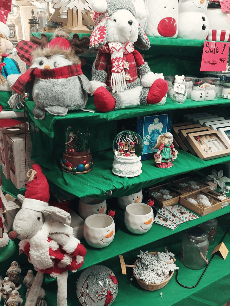 Cute holiday plush toys and Christmas decorations on display.