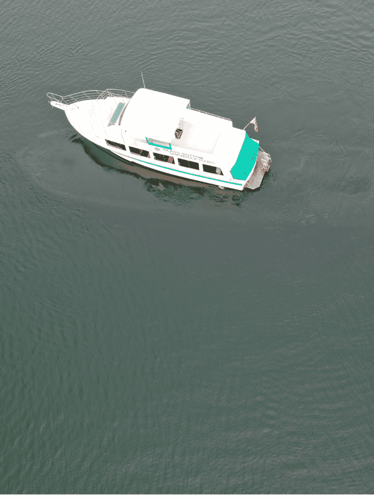 Luxury boat on calm water with scenic views for boat rental and marine travel.