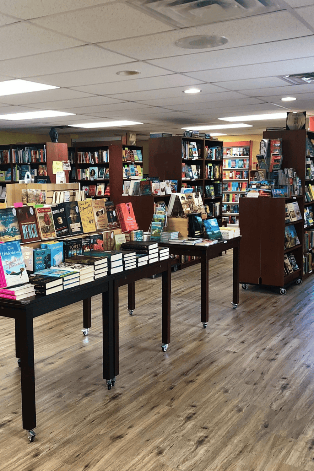 1. well-stocked bookstore interior with shelves of books and display tables.