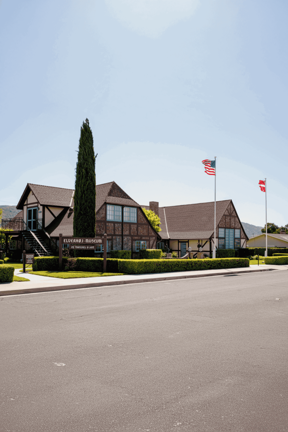 Historic Elverhøj Museum of Nordic Heritage with charming architecture and flags in Wisconsin.