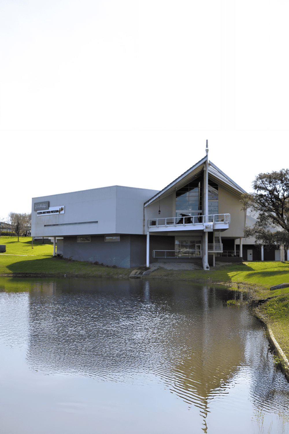 Modern church building with water reflection at Quest For Directions in Texas.