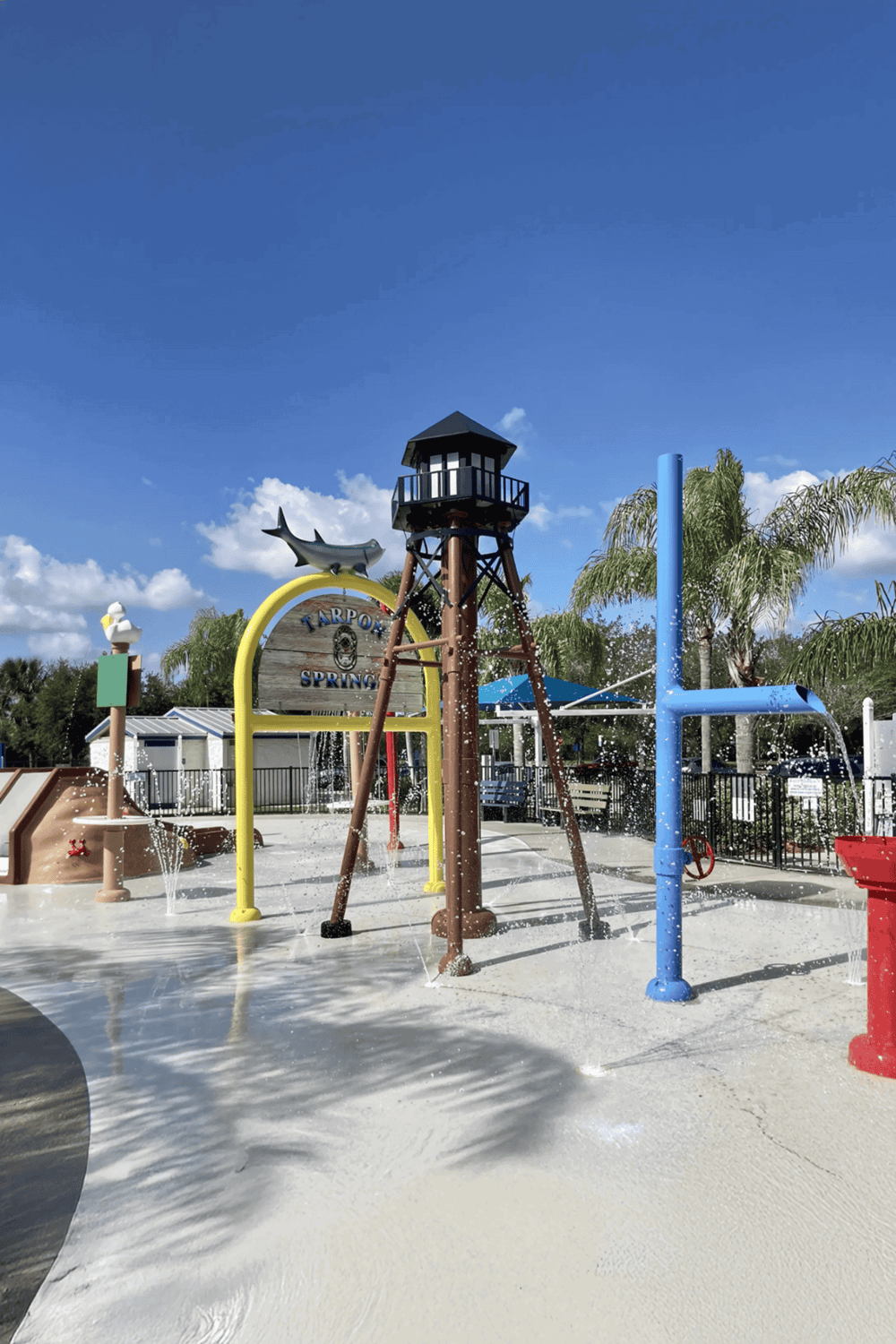 Colorful splash pad and water play area at Tapson Spring, perfect for kids' outdoor fun and hydration.