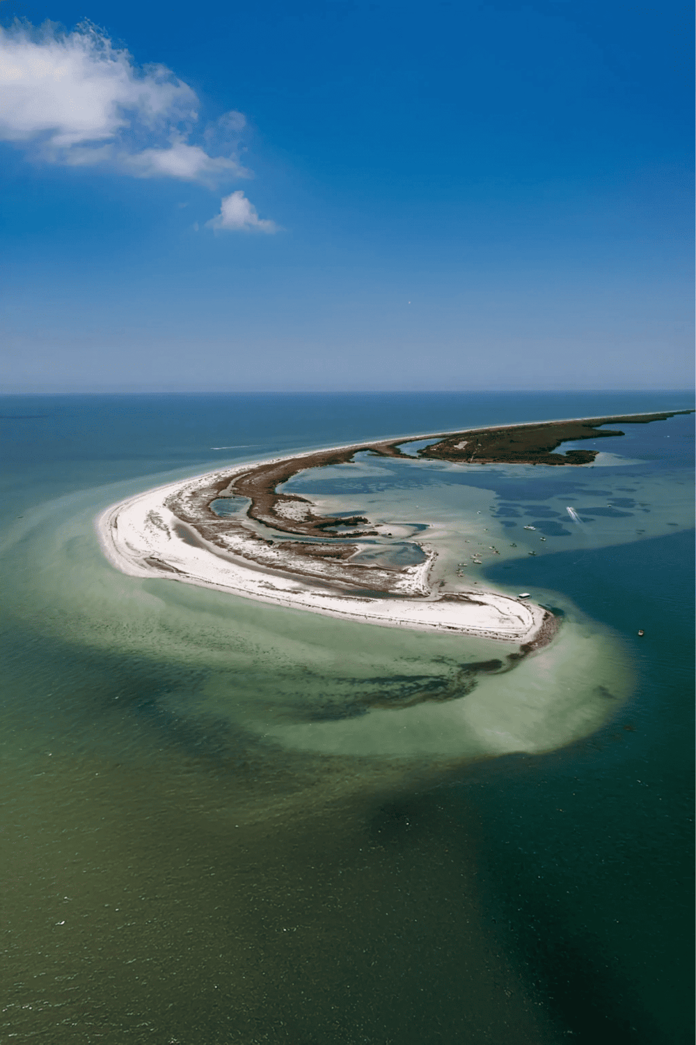 Seaside island with sandbars and waterways, scenic coastal landscape for travel and nature exploration.