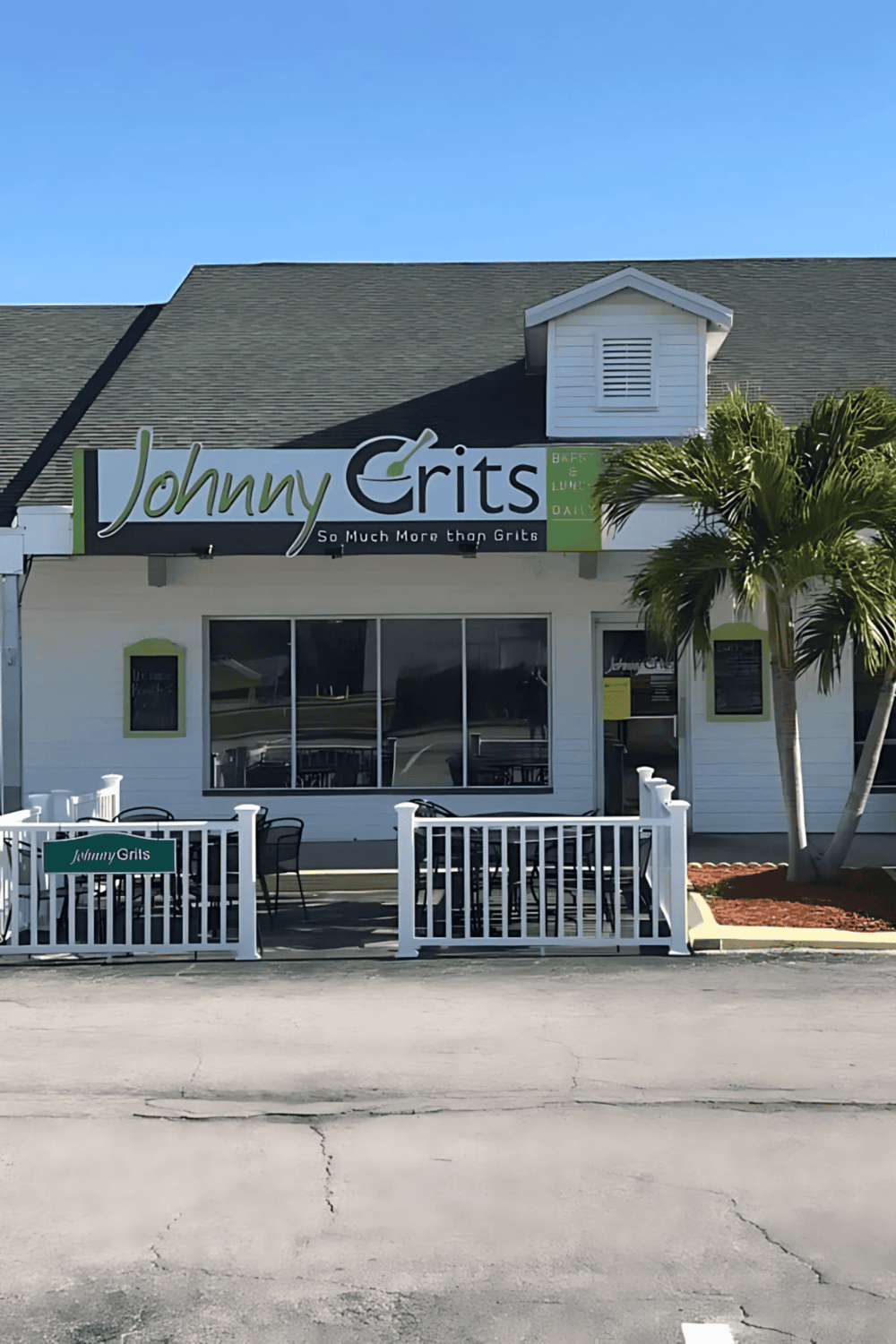 Comfortable outdoor seating at Johnny Grits restaurant, popular for breakfast and lunch dining.