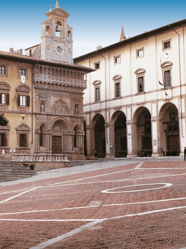 Ancient Italian city square with historic architecture and cobblestone streets.