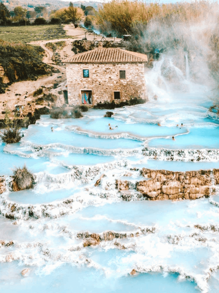 Soaking in natural hot springs with scenic mountain views at QuestForDirections.