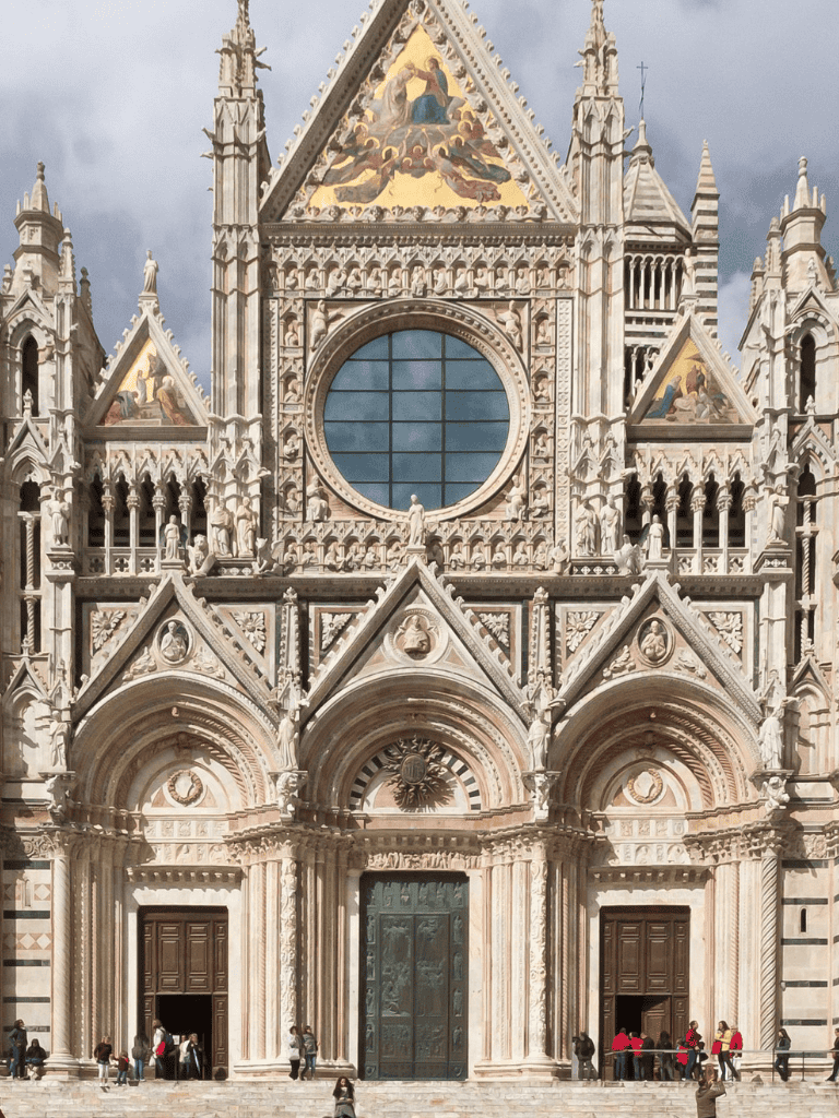 Intricate Gothic-style cathedral facade with detailed sculptures and ornate architecture.