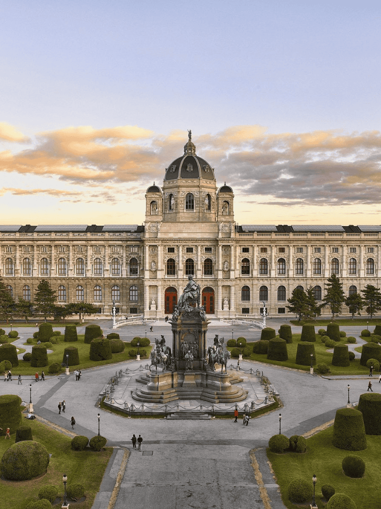 Majestic government building with grand architecture and manicured gardens, a historic landmark for city tours.