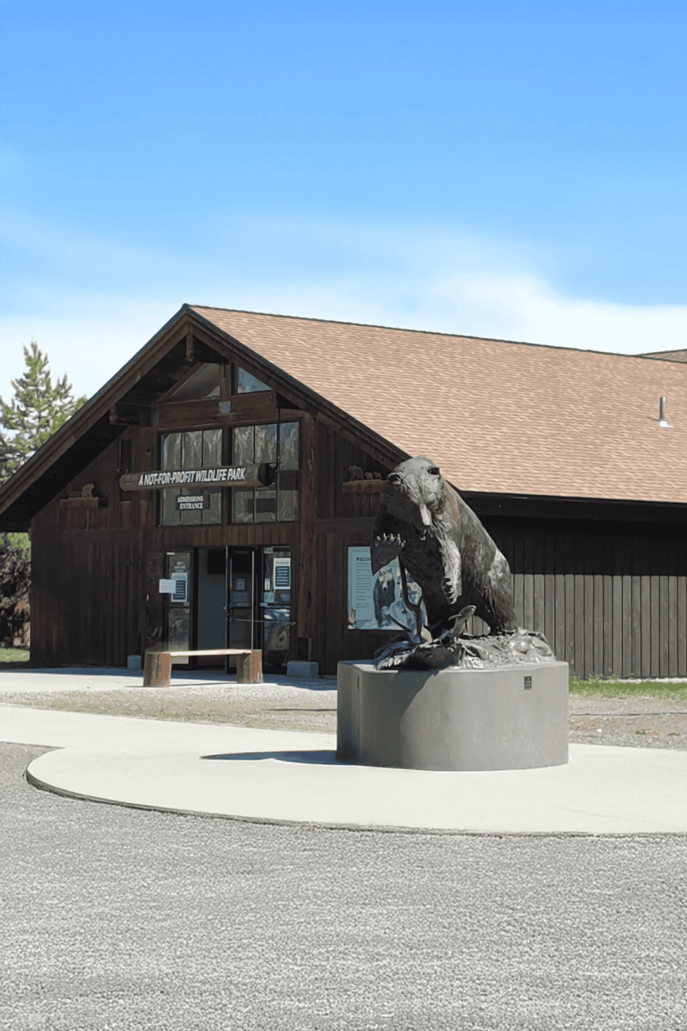Reticulated Python statue outside wildlife park visitor center for quest for directions.