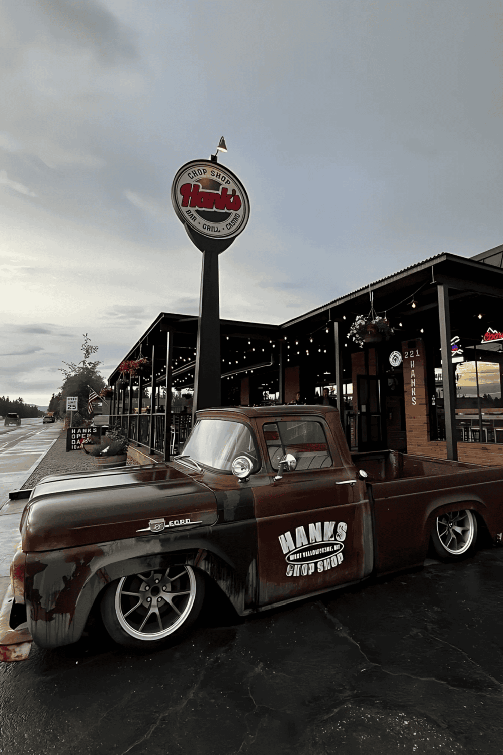 Vintage truck parked outside Hank's Chop Shop restaurant and bar.
