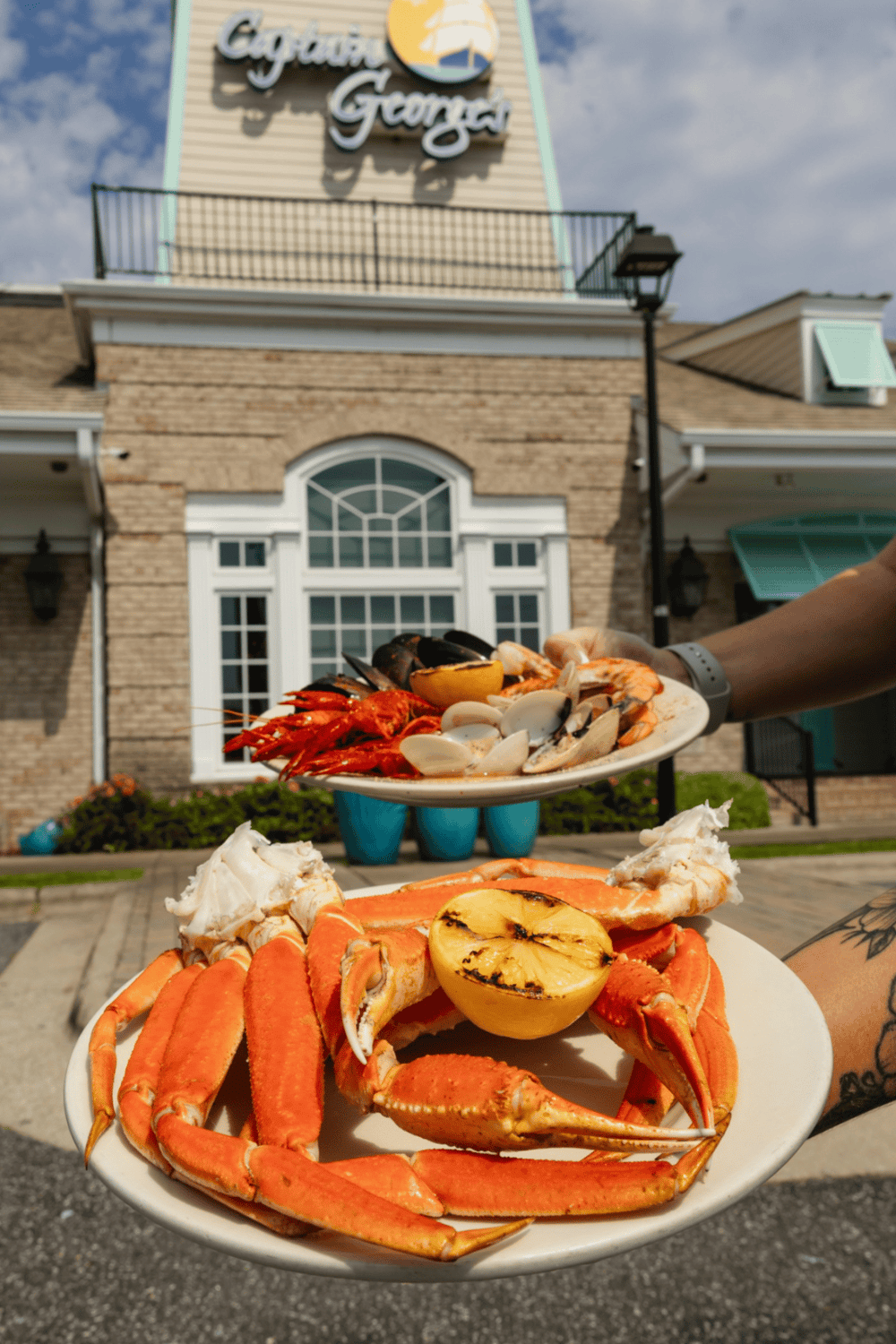 Fresh seafood platter with lobster, shrimp, and clams outside a charming restaurant in Georgia.