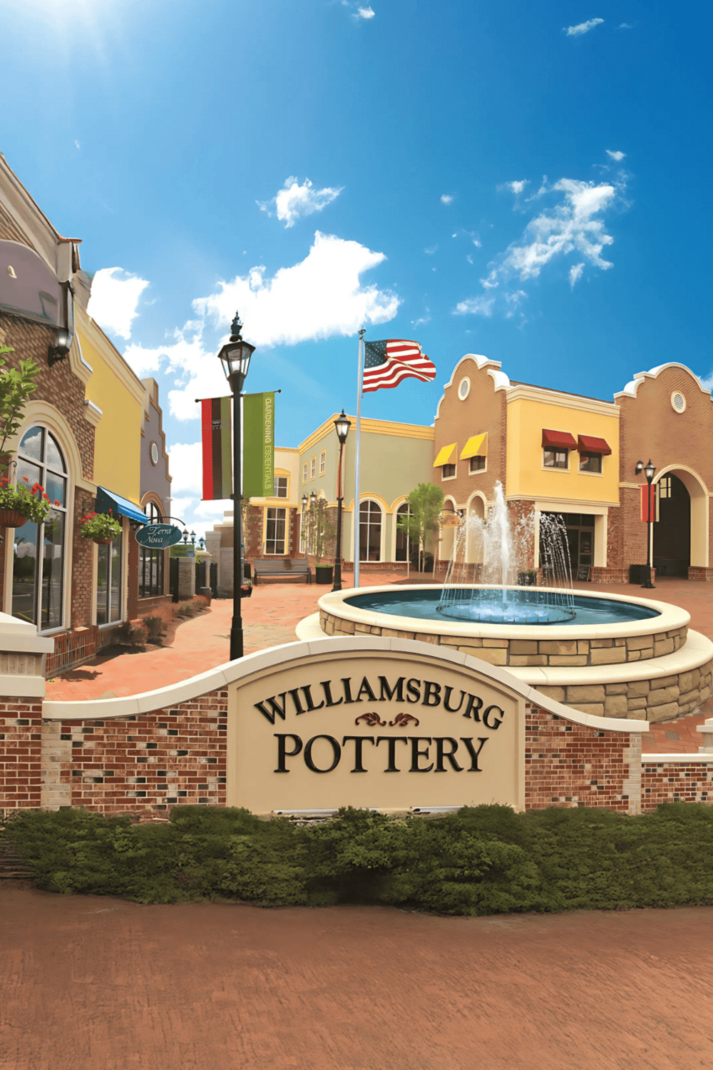 Aesthetically pleasing shopping plaza at Williamsburg Pottery with colorful buildings and a fountain.