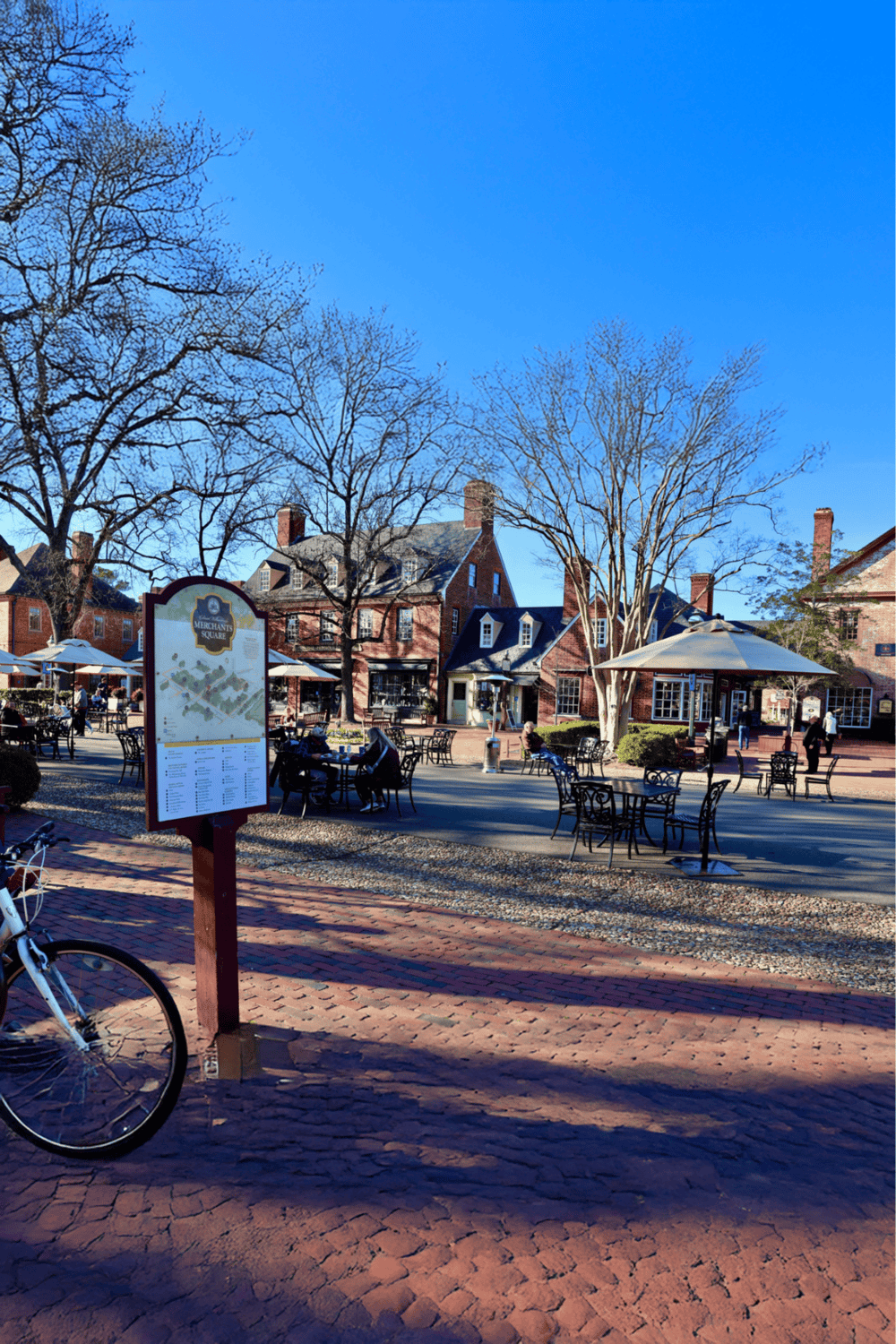 Bicycle parking area at Merchant's Square in Arlington, VA during daytime with clear blue sky.