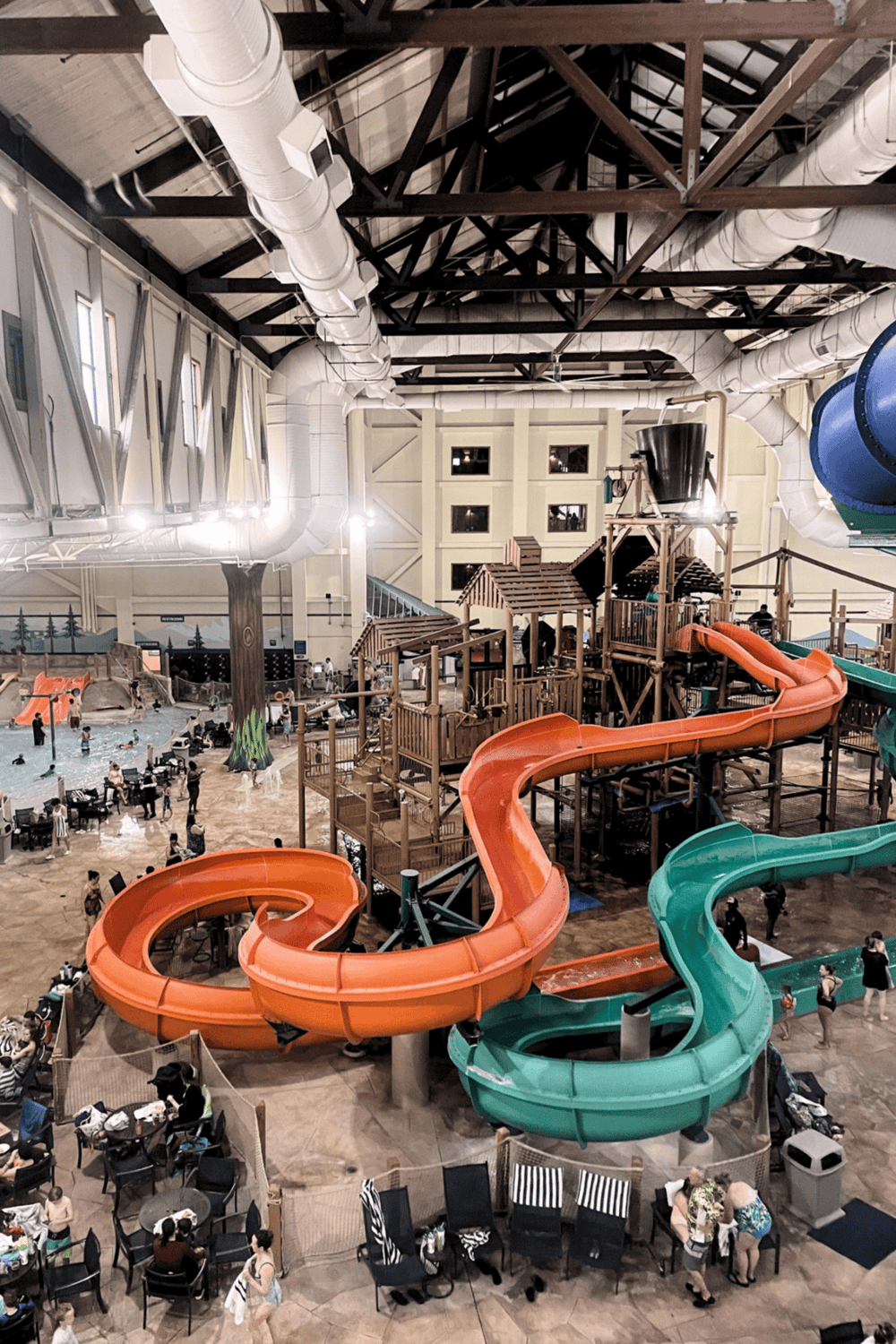 Indoor water park with colorful water slides and leisure pools, family-friendly entertainment at QuestForDirections.