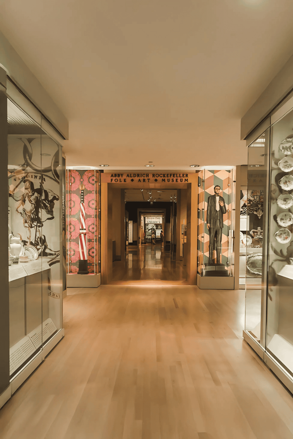 Colorful museum exhibit entrance with historical artifacts and art displays, showcasing folk art at the Abigail Aldrich Rockefeller Folk Art Museum.