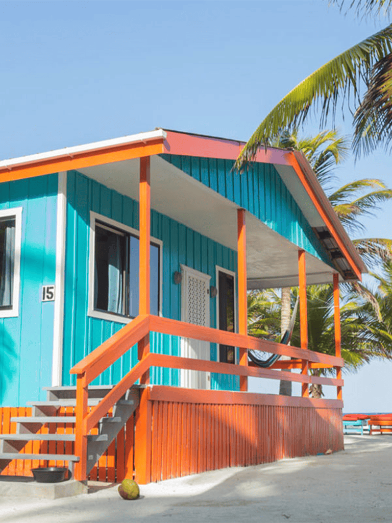 Beachside colorful vacation rental house in tropical paradise, perfect for seaside retreat.