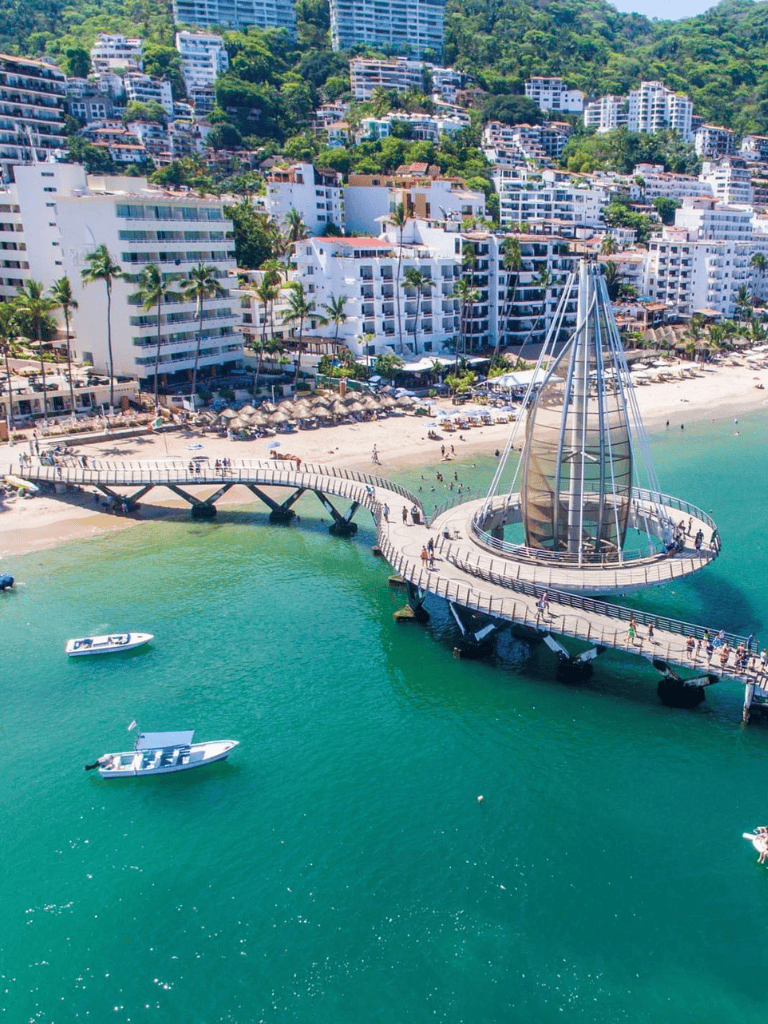 1. Modern pier with lighthouse in Tijuana, Mexico overlooking beachfront hotels and resorts.