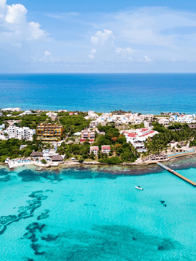 Gorgeous coastal town with turquoise waters and white buildings, ideal for travel planning and destination finding.