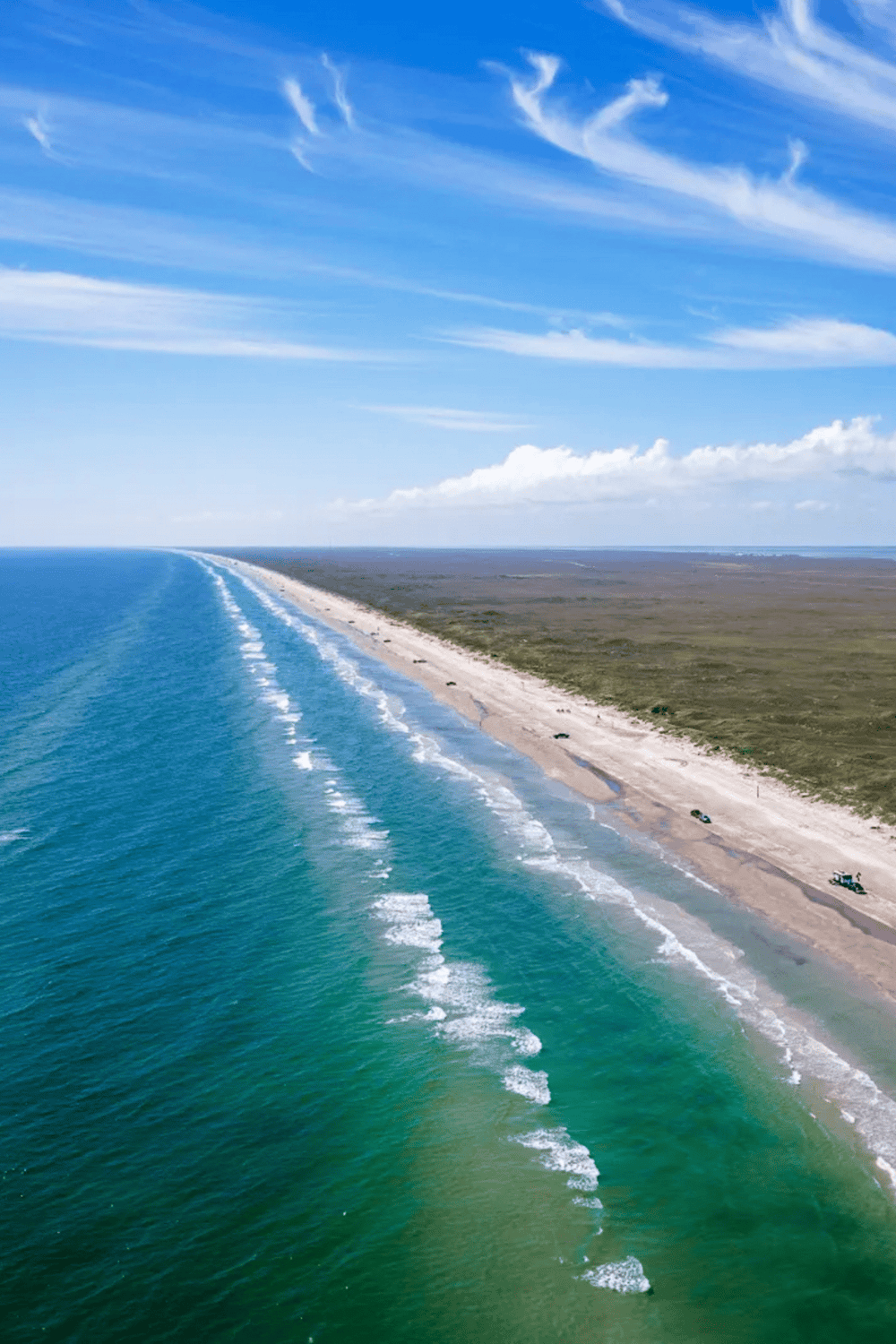 Seaview beach along the coast with clear blue water and scenic sky, perfect for travel and outdoor adventures.