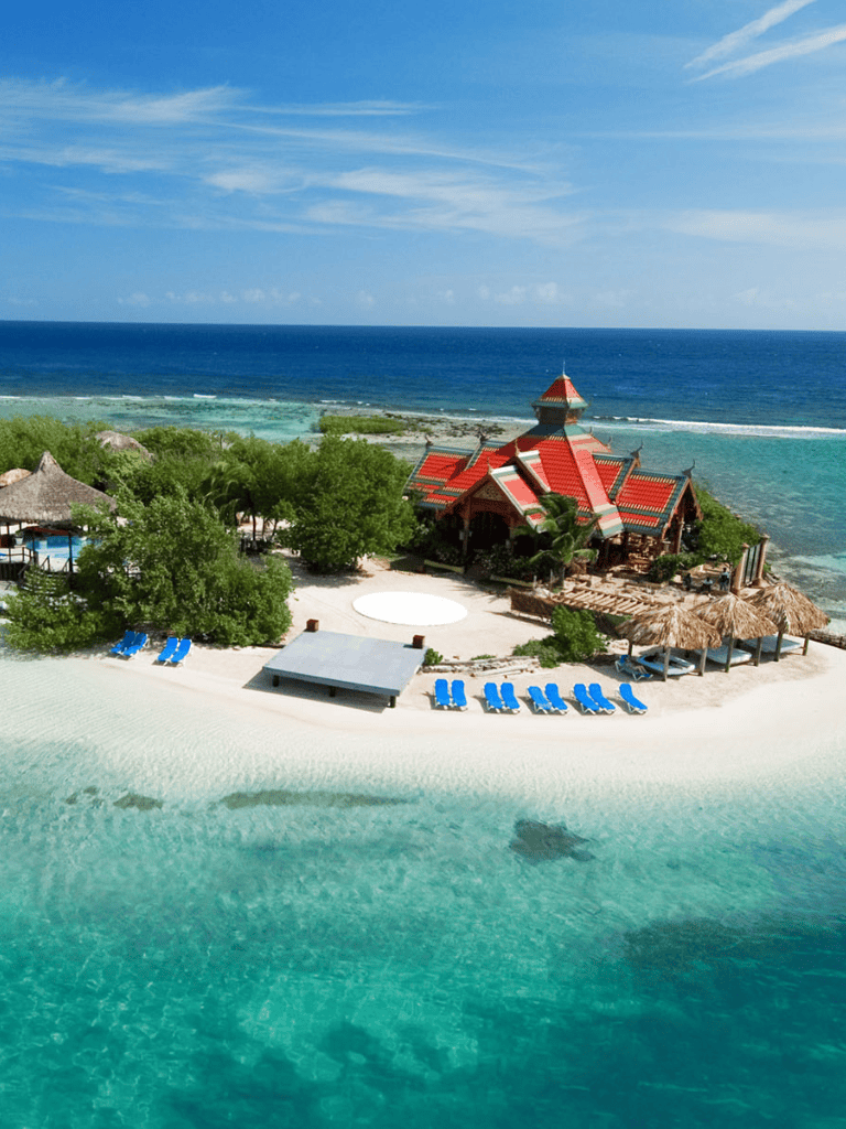Stunning beach resort with turquoise waters and tropical landscape for travel and destination planning.
