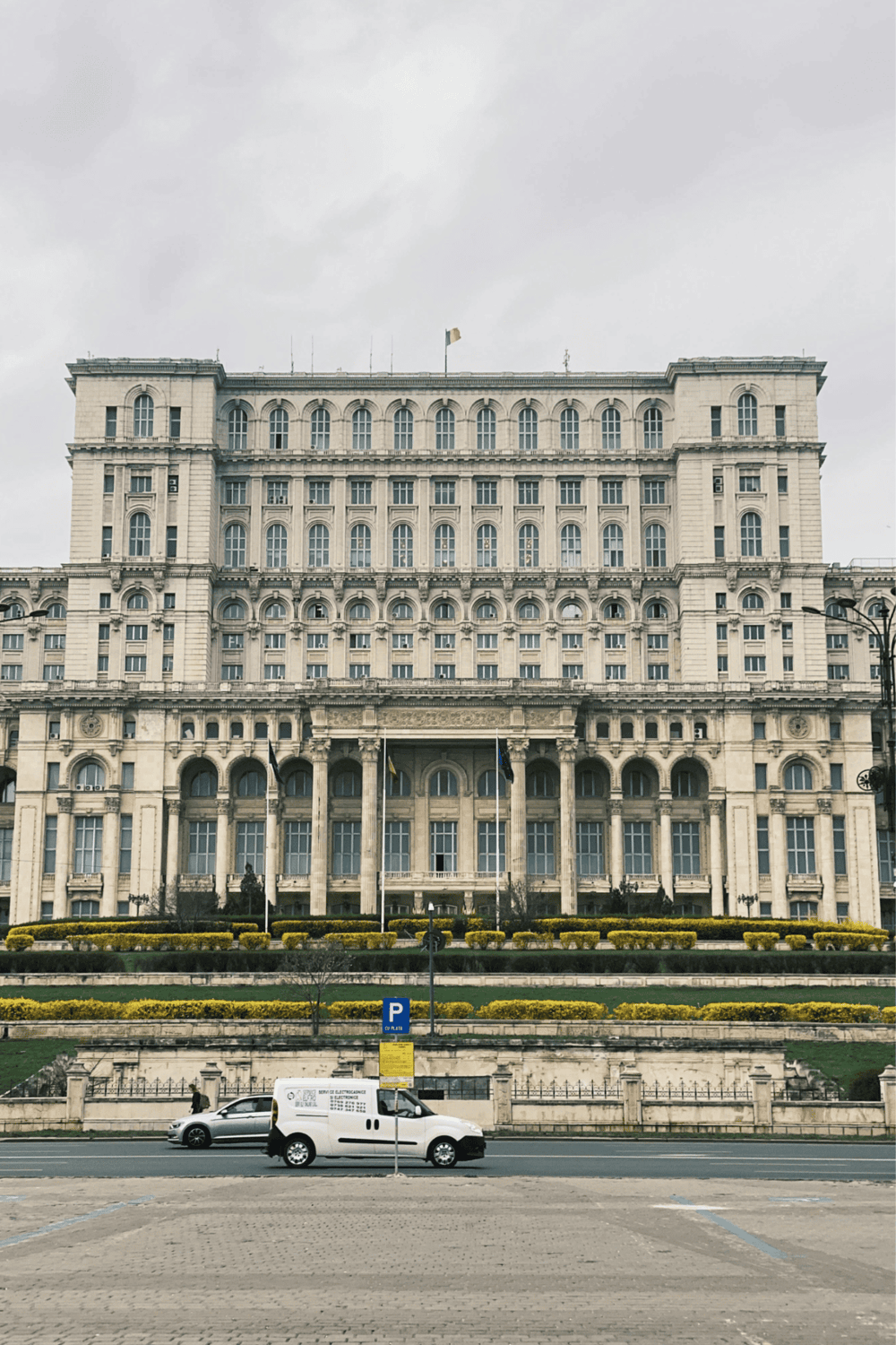 Historic government building in Romania, connecting users with directions and navigation services.