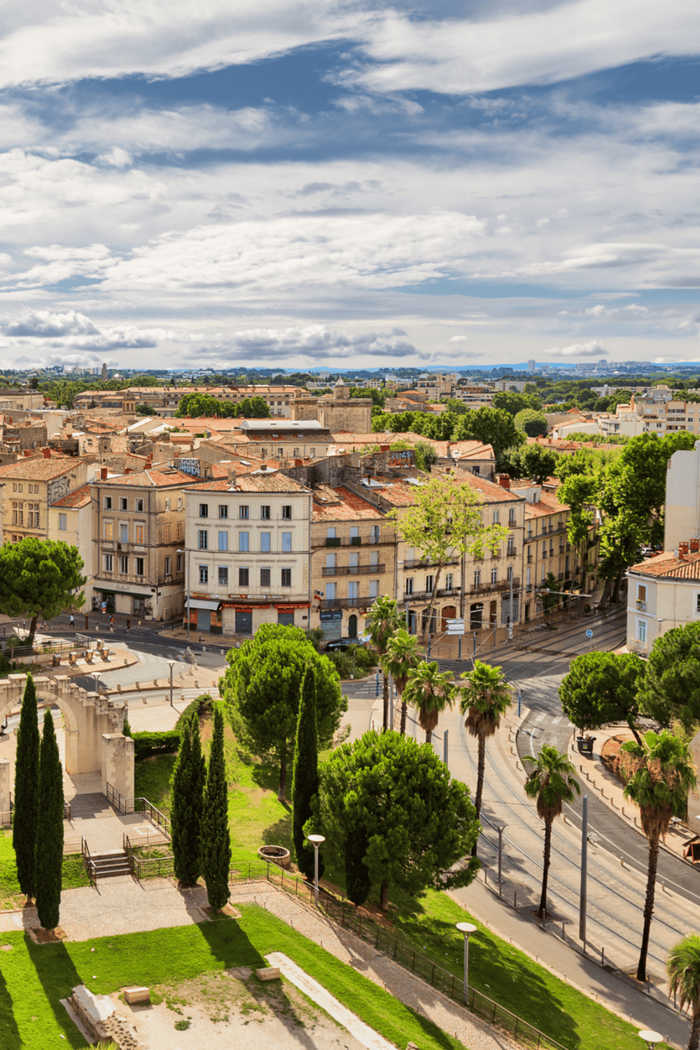 Colorful European cityscape with historic buildings and lush greenery, perfect for travel and exploration.