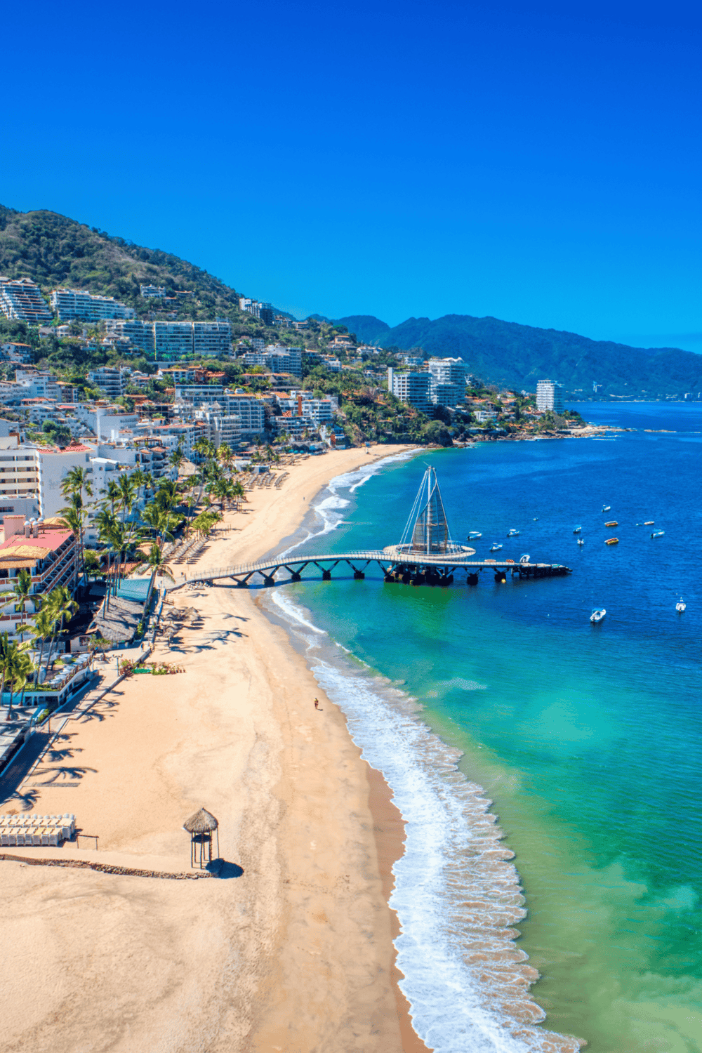 Relaxing beach view in Mexico with clear turquoise waters and scenic coastline.