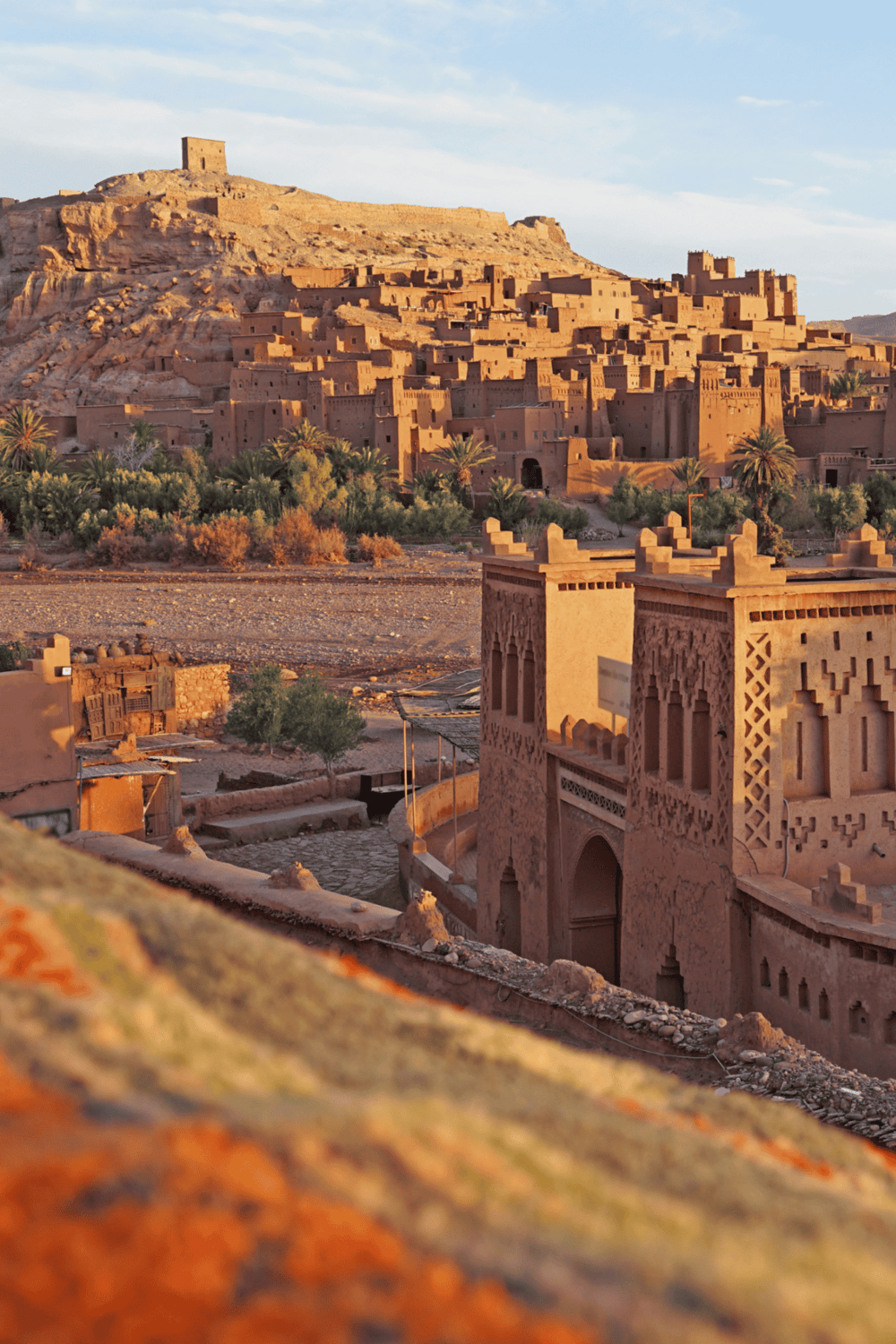 Ancient Moroccan hilltop town with traditional Berber architecture and desert landscape.