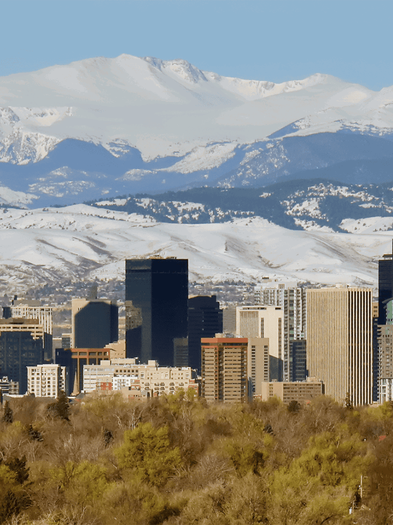 Snow-capped mountains overlooking downtown cityscape, scenic views, QuestForDirections.