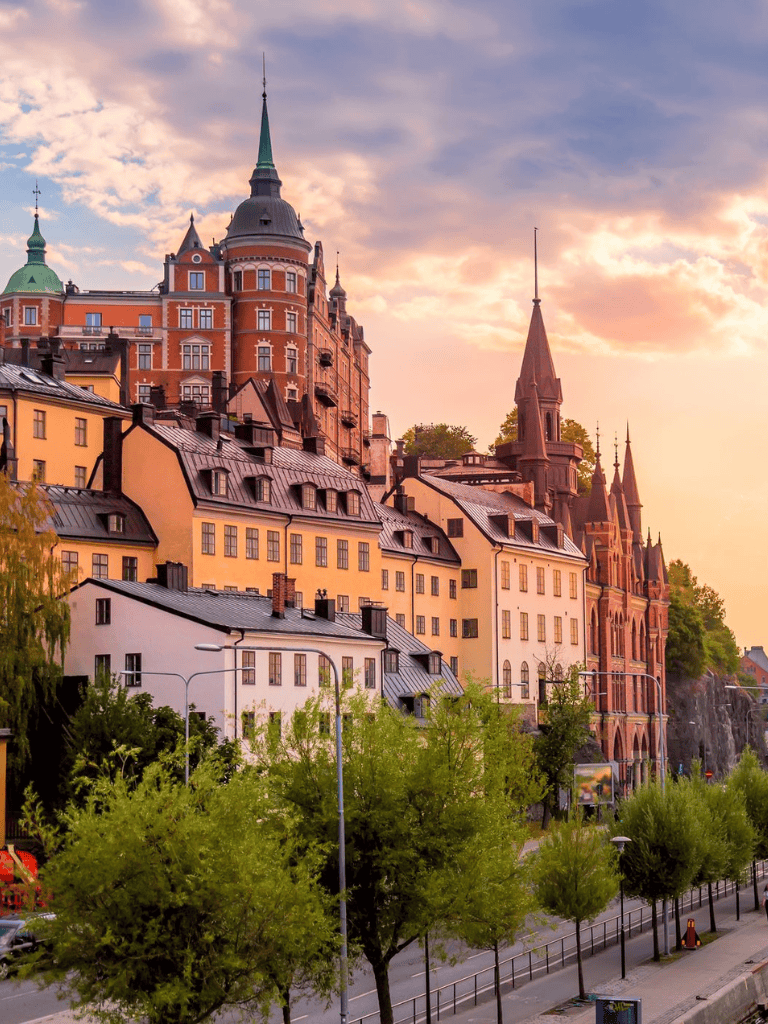 Colorful historic buildings in Stockholm, Sweden at sunset, showcasing Scandinavian architecture and cityscape.