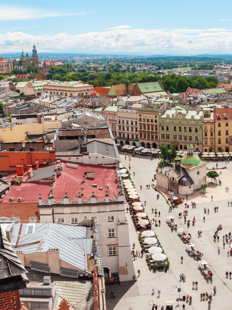 Vibrant European cityscape with historic buildings and bustling square, perfect for travel and tourism photography.
