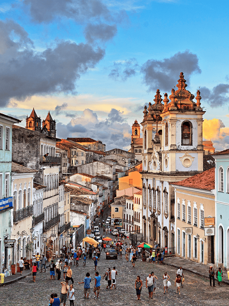 Colorful historic city street in Antigua Guatemala with colonial architecture and lively atmosphere.