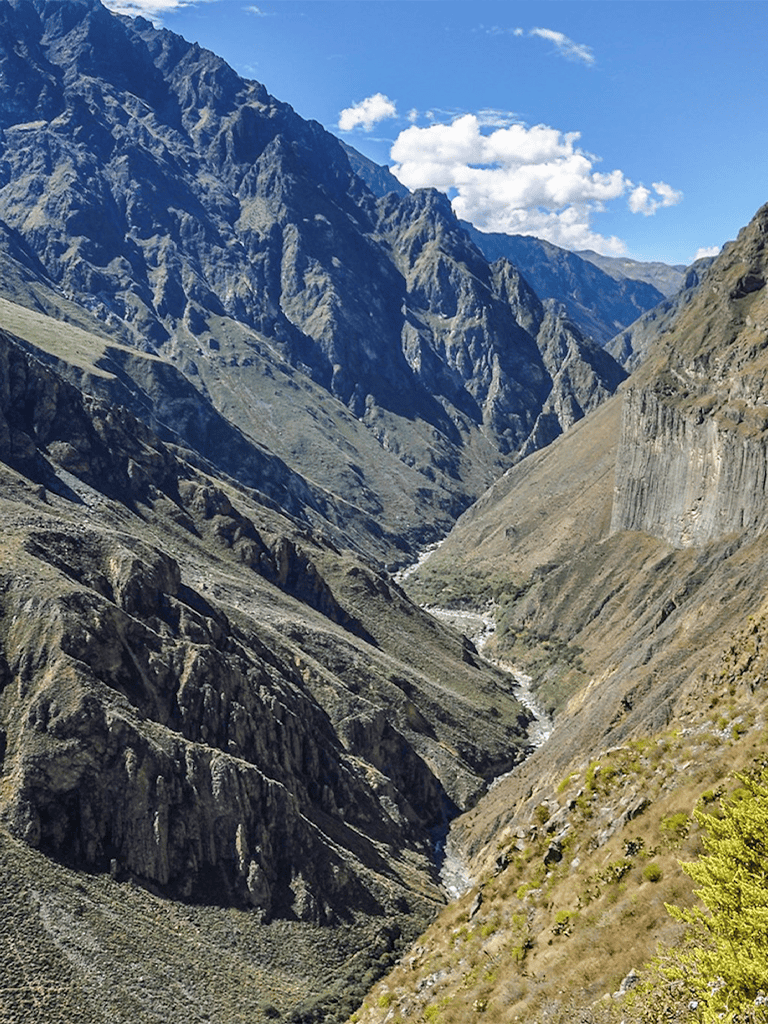 Striking mountain landscape with rugged cliffs and deep valley, ideal for outdoor adventure and nature exploration.