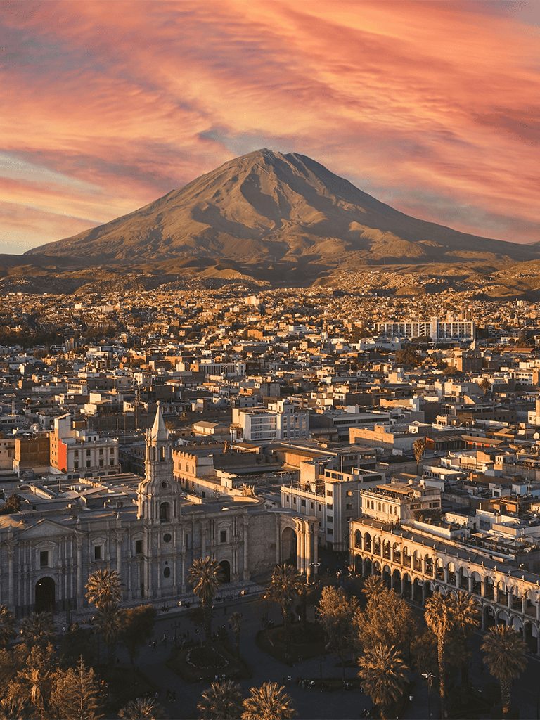 Stunning view of Mount Teide over San Cristobal de La Laguna in Tenerife, Spain at sunset.