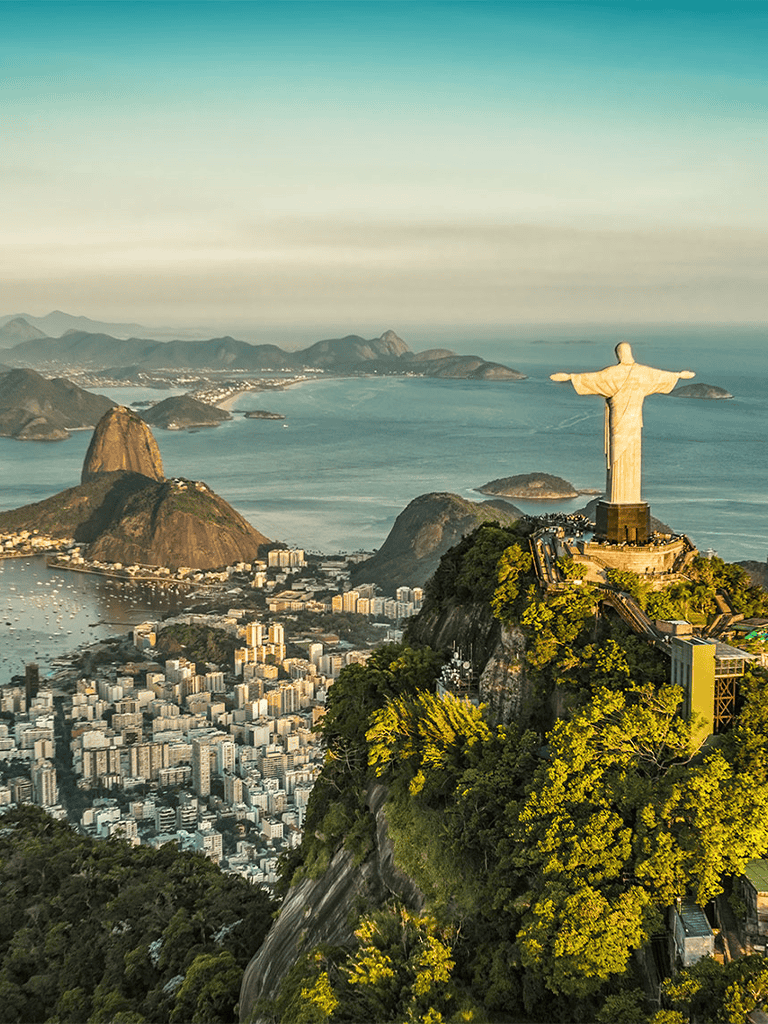 Stunning view of Rio de Janeiro with Christ the Redeemer statue overlooking the city and coastline.