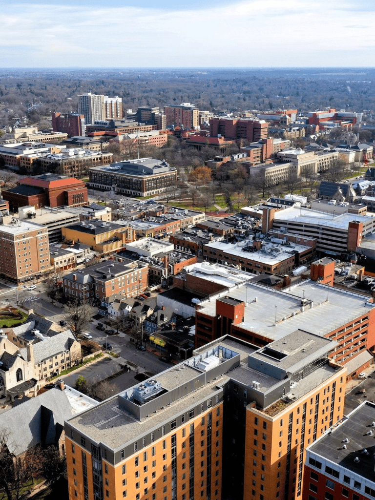 Aerial view of downtown QuestForDirections city showcasing urban landscape and modern buildings.
