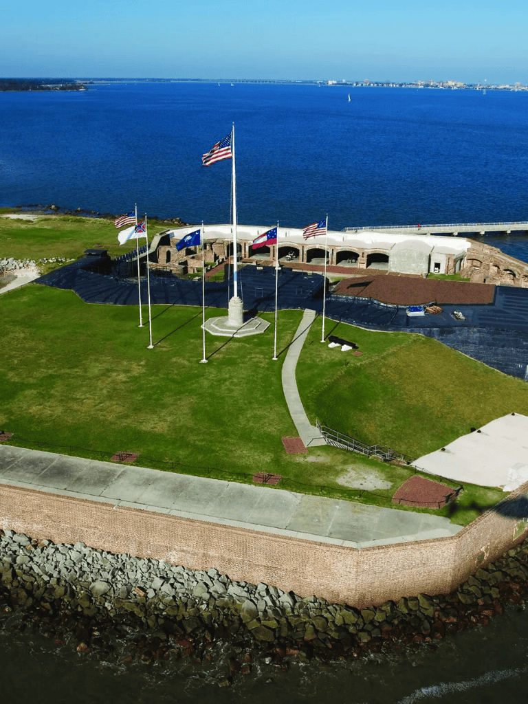 American flags flying over coastal historic site at QuestForDirections.