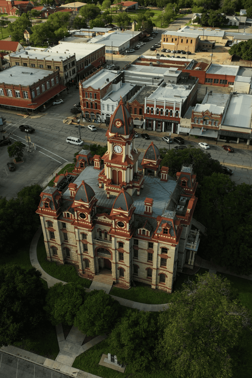 1. Aerial view of historic courthouse and charming downtown streets in QuestForDirections, Texas.