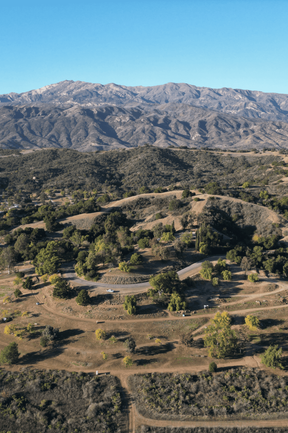 Serene mountain landscape with rolling hills and lush greenery, ideal for outdoor exploration and navigation.