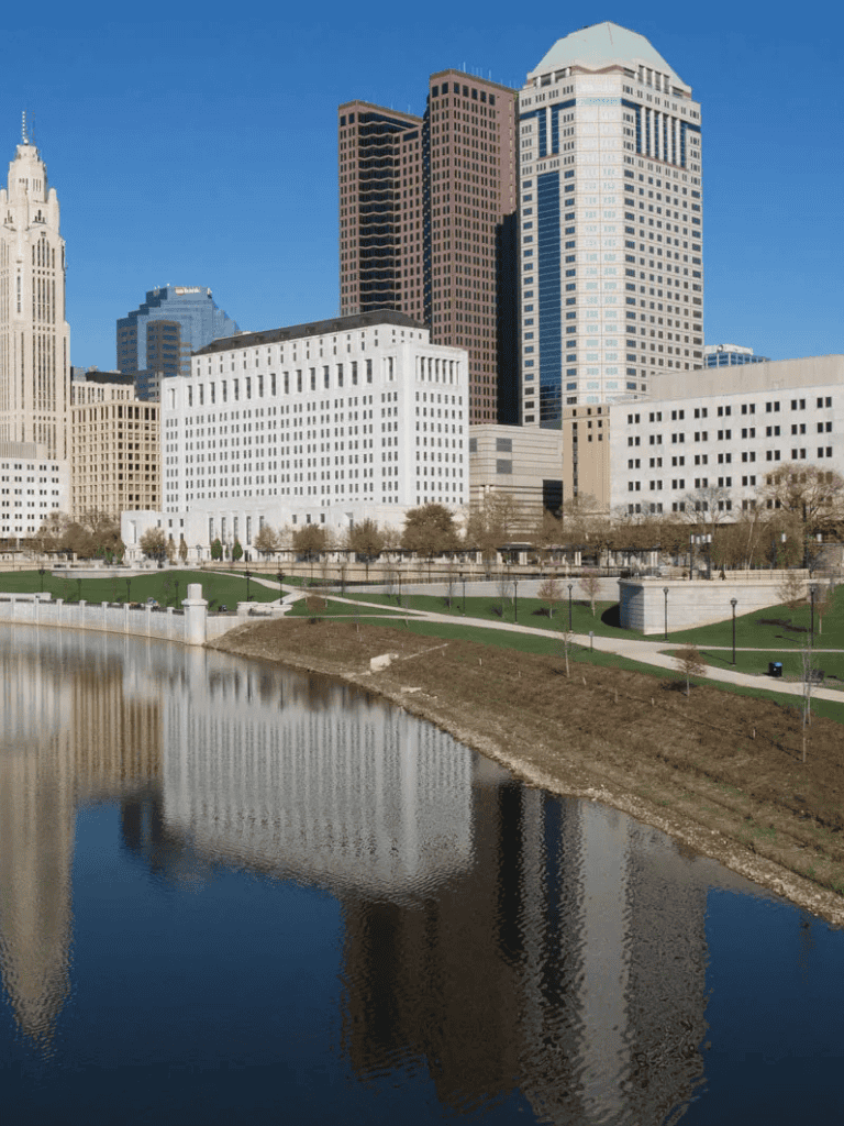 Modern city skyline with skyscrapers and a river in downtown Columbus, Ohio.